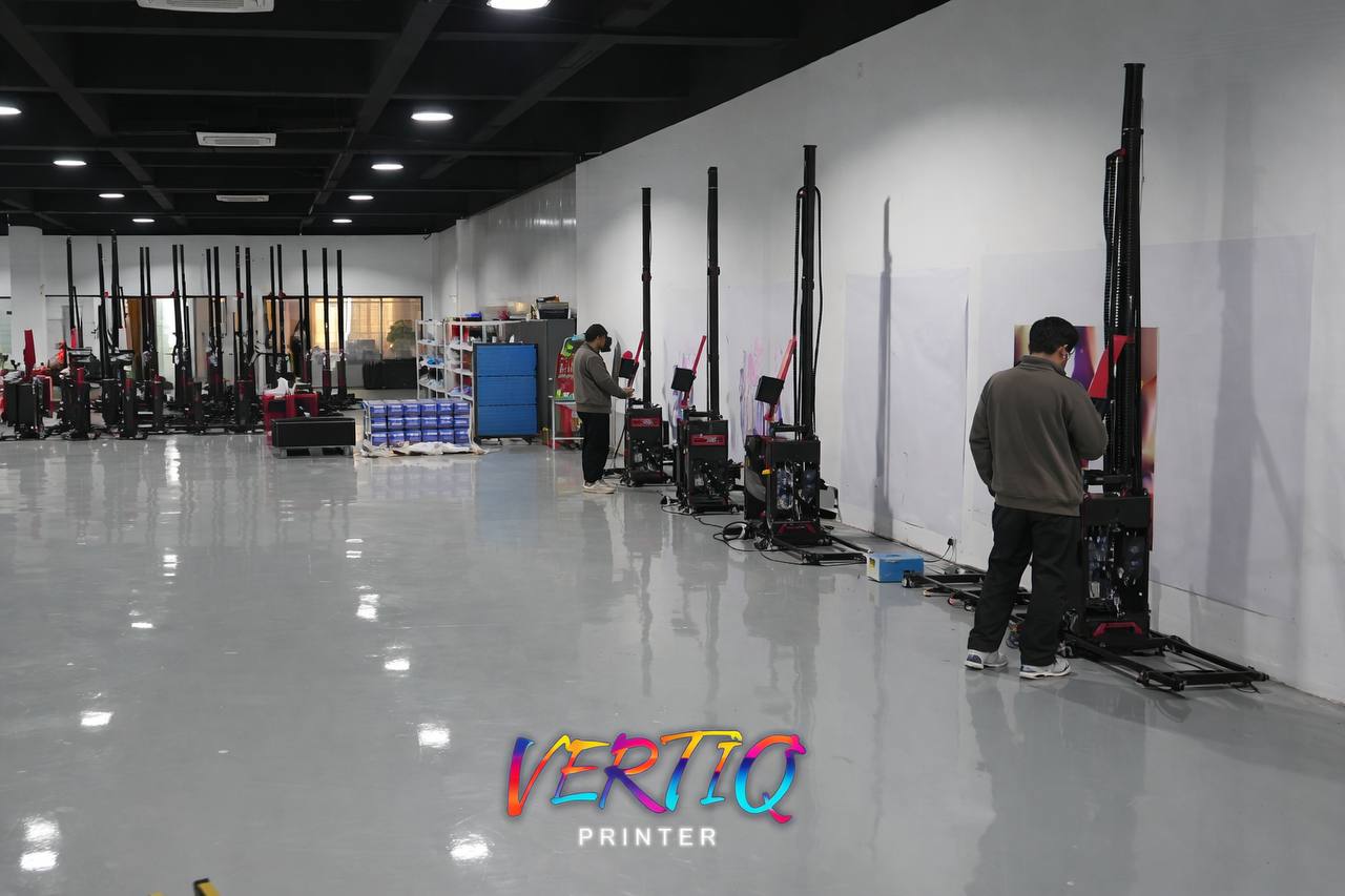 Quality testing — technicians calibrating Vertiq UV printers